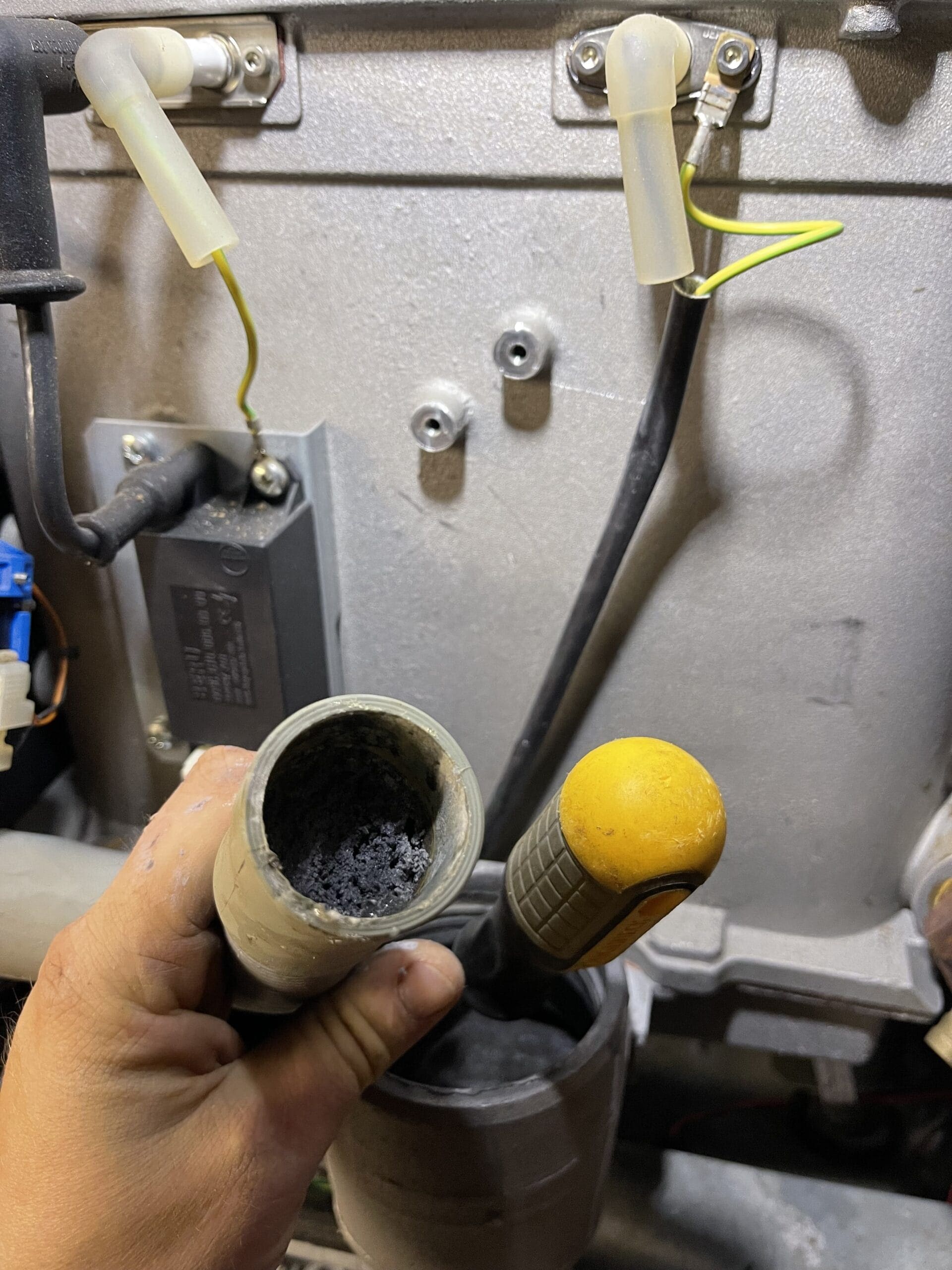 Commercial boiler flue cleaning in Norwich with soot build-up removed during servicing