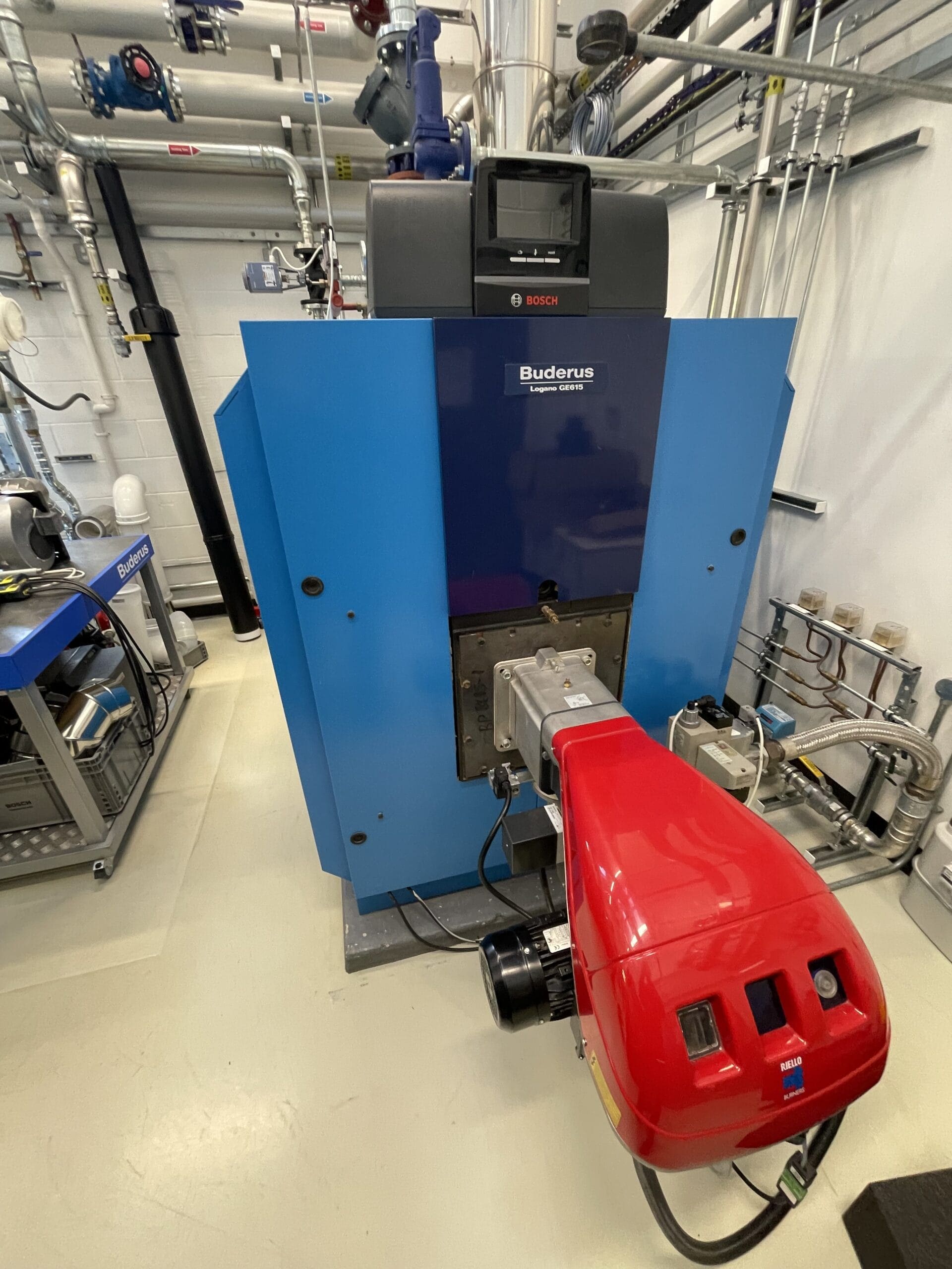 Commercial boiler servicing in Norfolk with Buderus boiler and Riello burner in a plant room