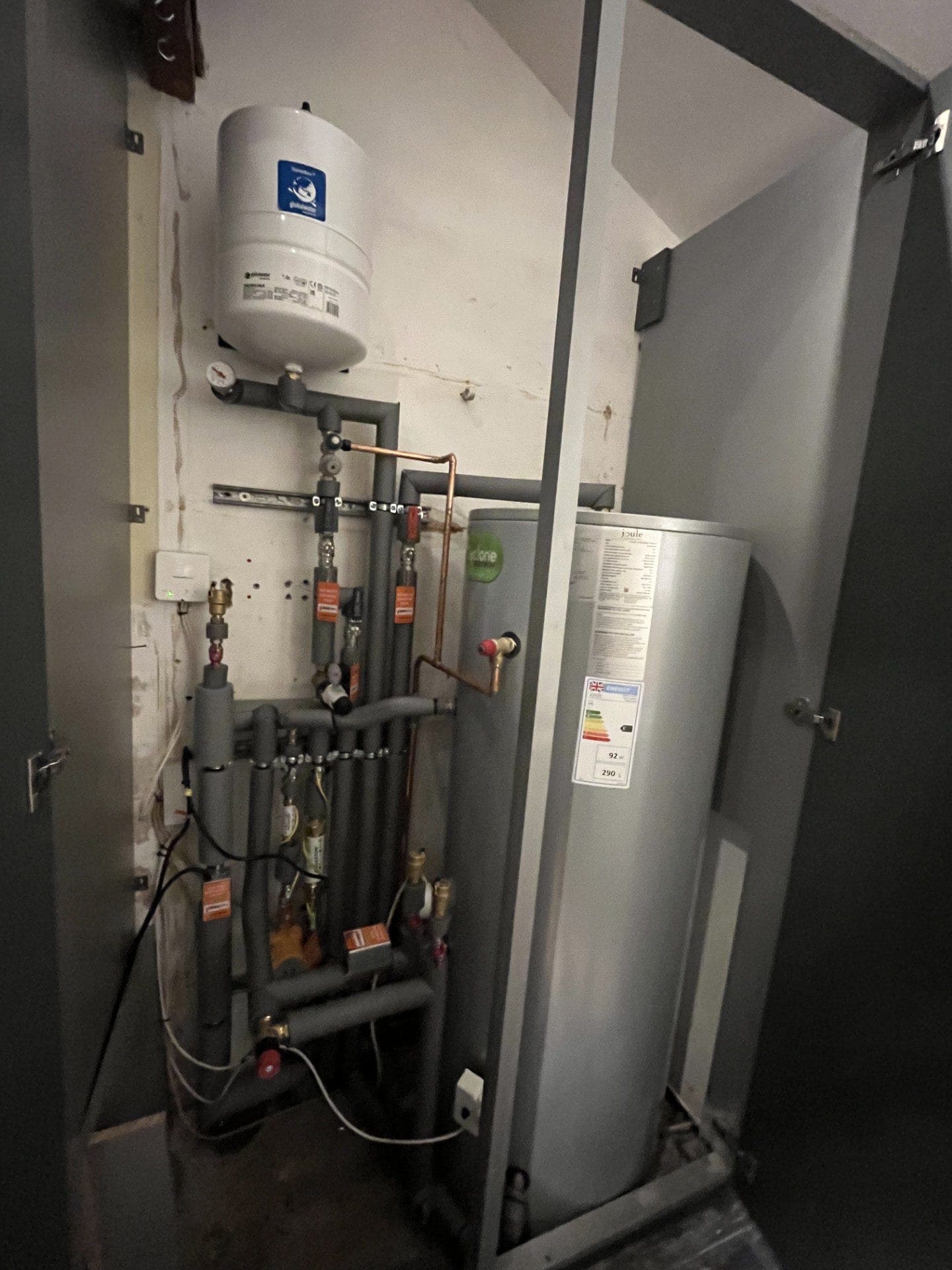 Hot water cylinder installation in Norwich with expansion vessel, controls and insulated pipework