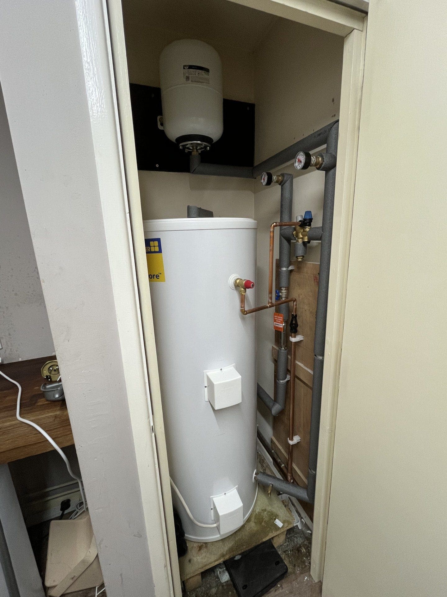 Hot water cylinder installation in Norwich with expansion vessel, valves and insulated pipework