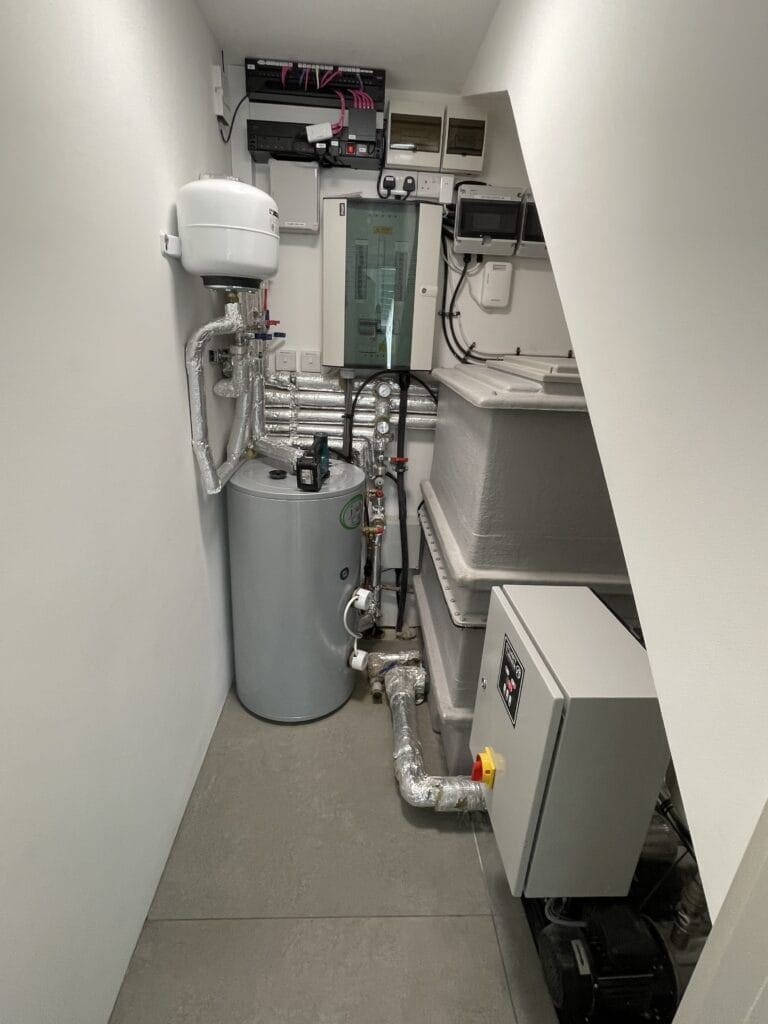 Commercial hot & cold water booster system in Norwich with cylinder, expansion vessel and insulated pipework