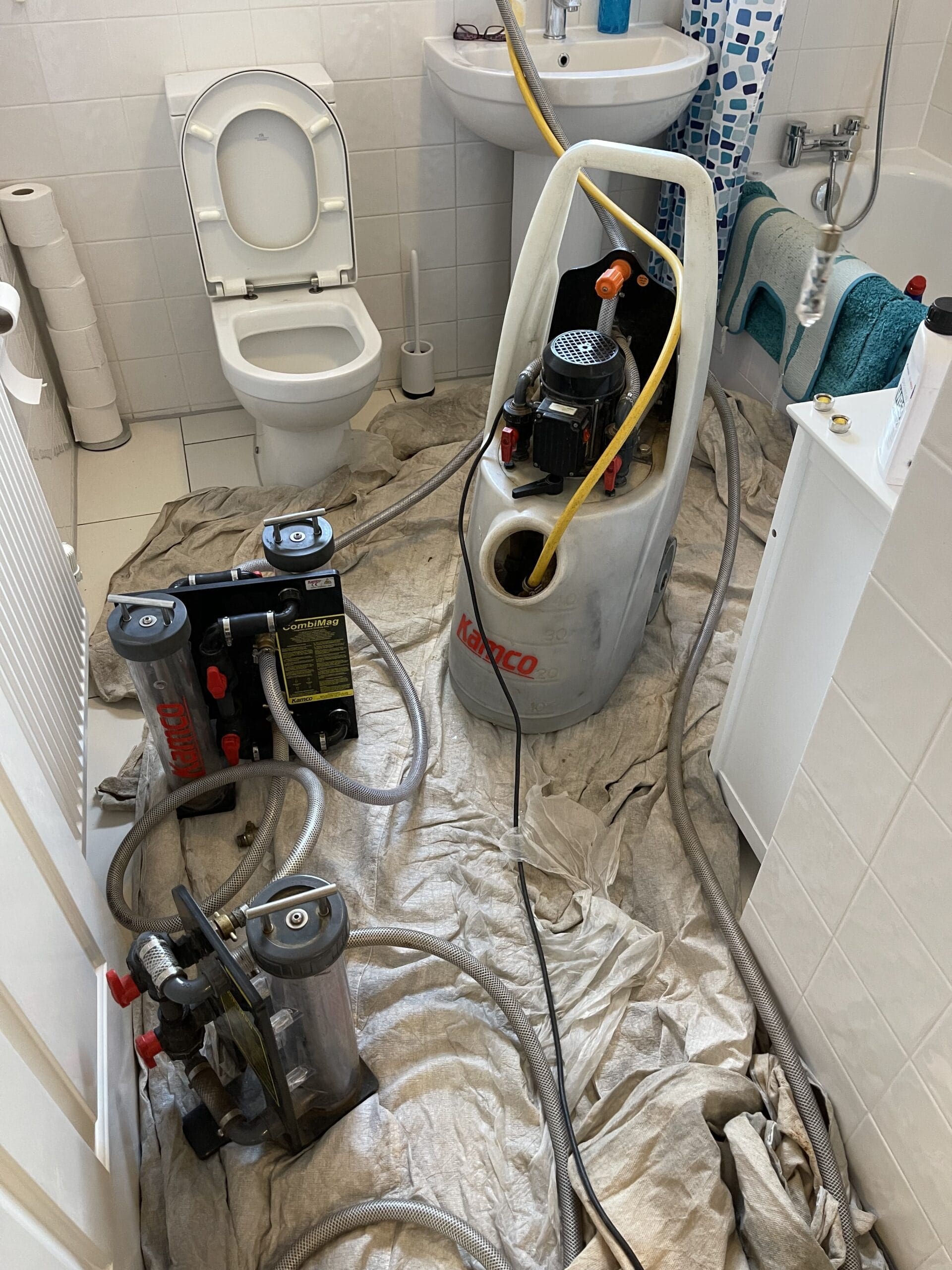 Bathroom heating power flush in Norwich with specialist flushing equipment connected to clean the system