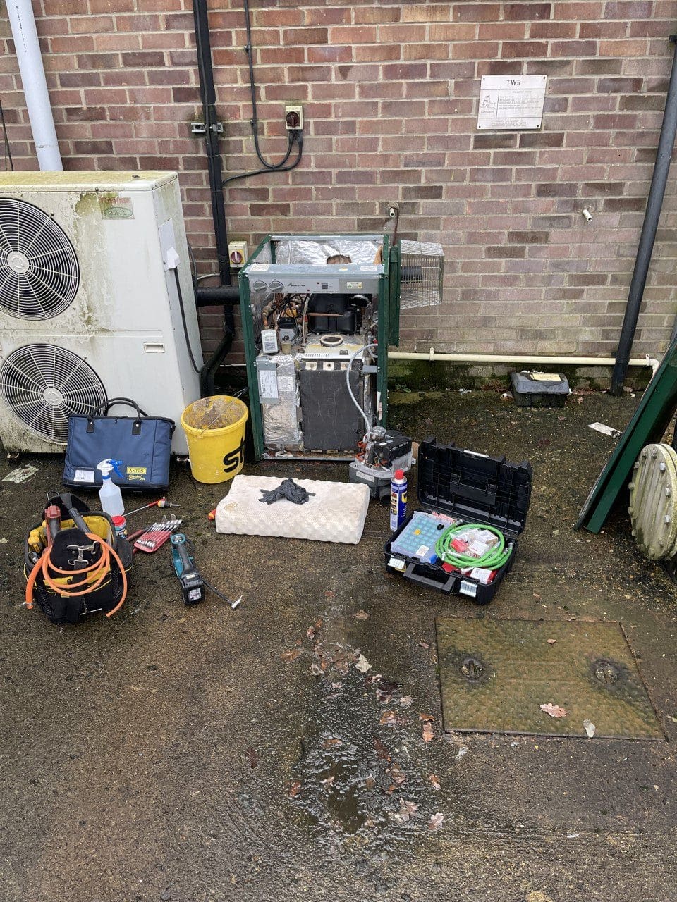 Boiler service in Norfolk with external boiler opened for inspection and maintenance