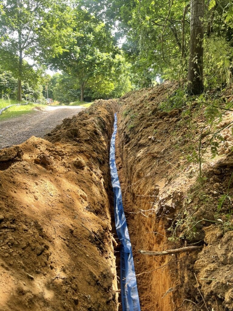 Why Low Water Pressure Affects Some Horning Properties | Allstar Systems Ltd Plumber checking low water pressure in a Horning property