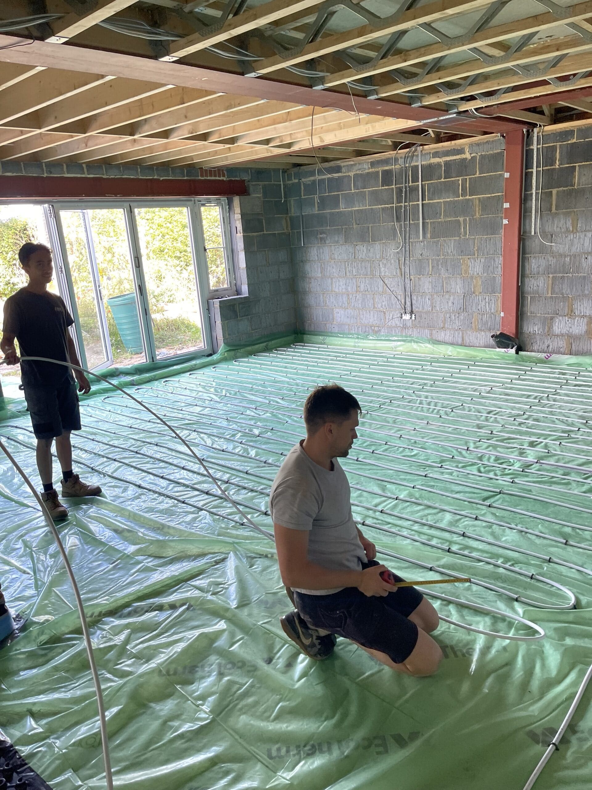 Underfloor heating installation in Norwich with pipework being fitted before floor screed