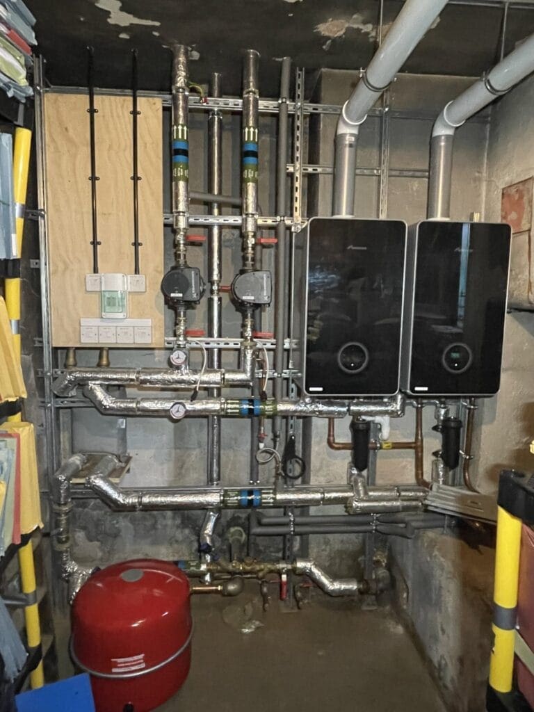 Commercial plumbing and heating engineer working at a managed premises in Mulbarton
