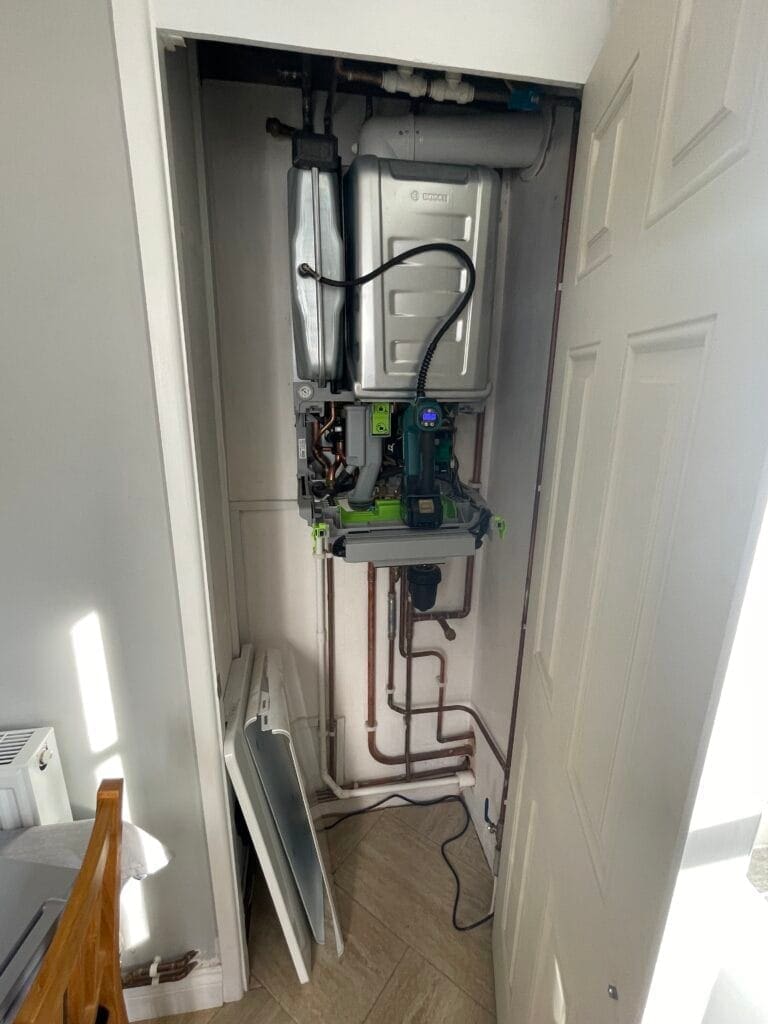 Why Recurring Boiler Pressure Loss in North Walsham Should Not Be Ignored | Allstar Systems Ltd Heating engineer checking recurring boiler pressure loss in a North Walsham home