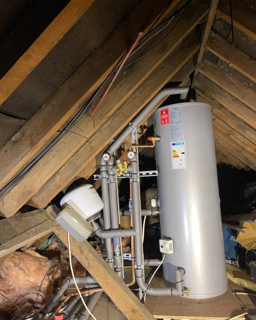 Joule unvented hot water cylinder installed in a loft with insulated pipework and expansion vessel in Norfolk