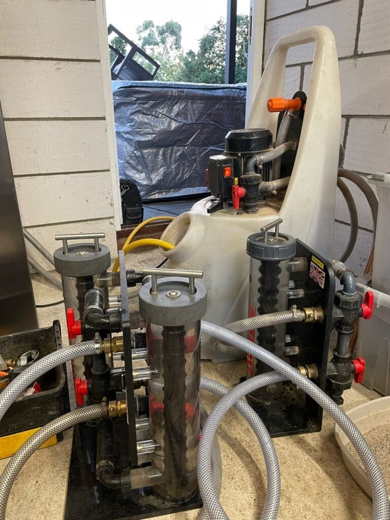 Why System Cleaning Matters Before Boiler Replacement in Mulbarton | Allstar Systems Ltd Heating engineer checking system cleaning before boiler replacement in a Mulbarton home