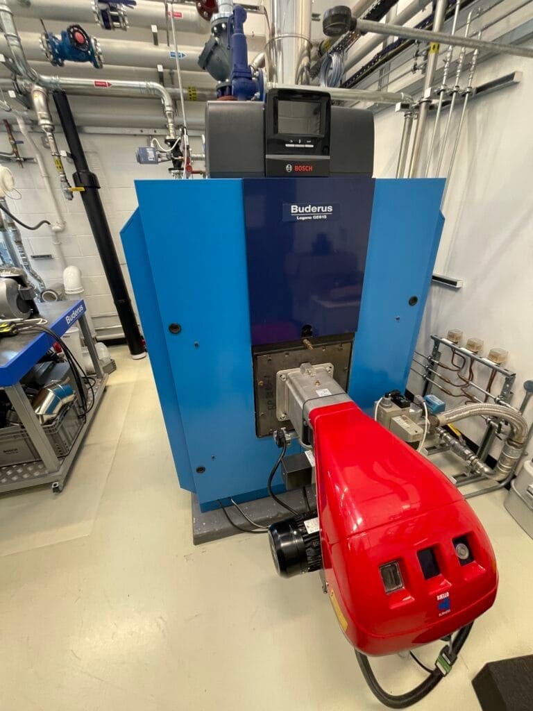 Commercial gas boiler with burner in a plant room for servicing, testing and maintenance